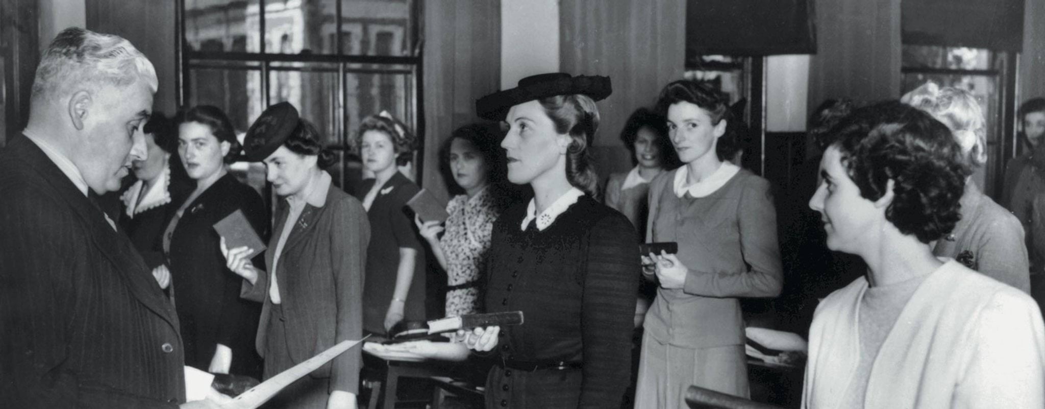 Photo of women police recruits swearing on the bible